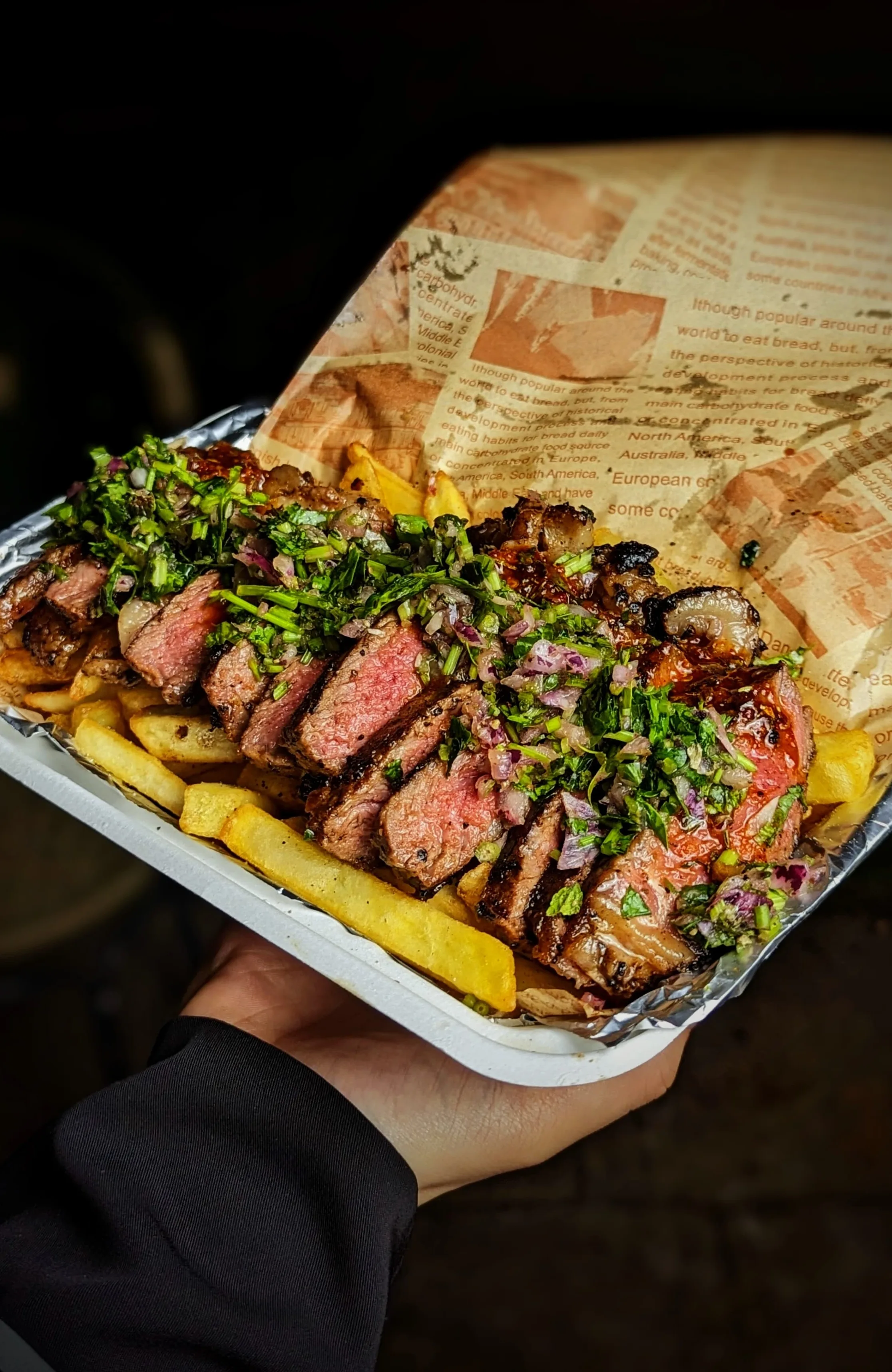 Large steak and chips with fresh toppings